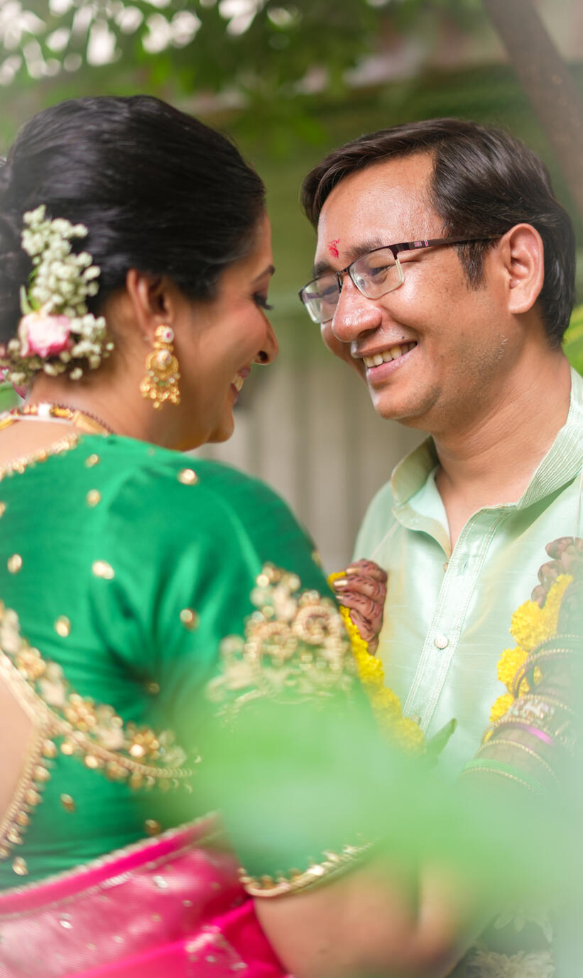 Close-up romantic portrait of Shweta and Sandeep Rawat sharing an intimate candid moment during their wedding celebration.