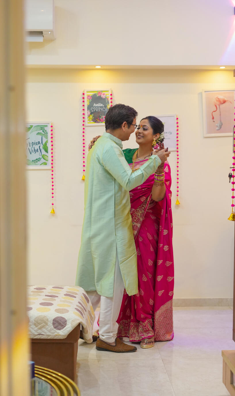 Shweta and Sandeep Rawat sharing a joyful romantic moment during their vibrant wedding celebration captured by Snapory.